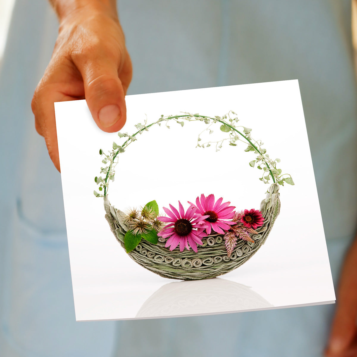A hand held echinacea bag greeting card. This gorgeous card is found at Golly Gosh Creations. Size 142 x 142 mm
