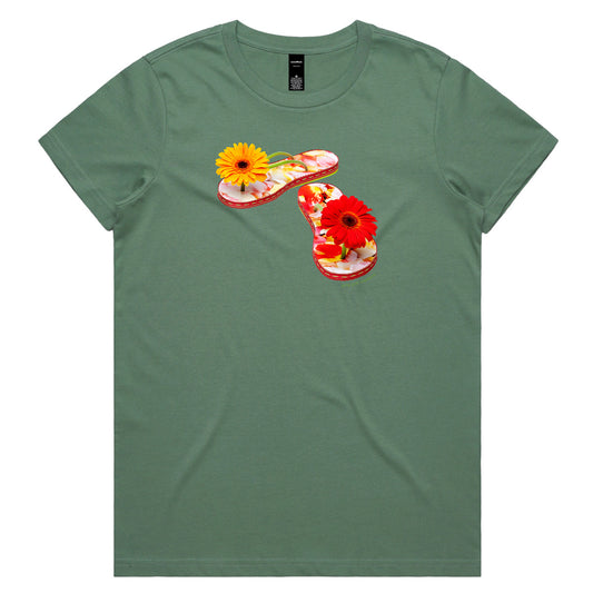 A gerbera jandals sage woman's tee shirt from Golly Gosh Creations. Sizes XS - 2XL. Created from colourful fresh gerbera flowers. Quality cotton.
