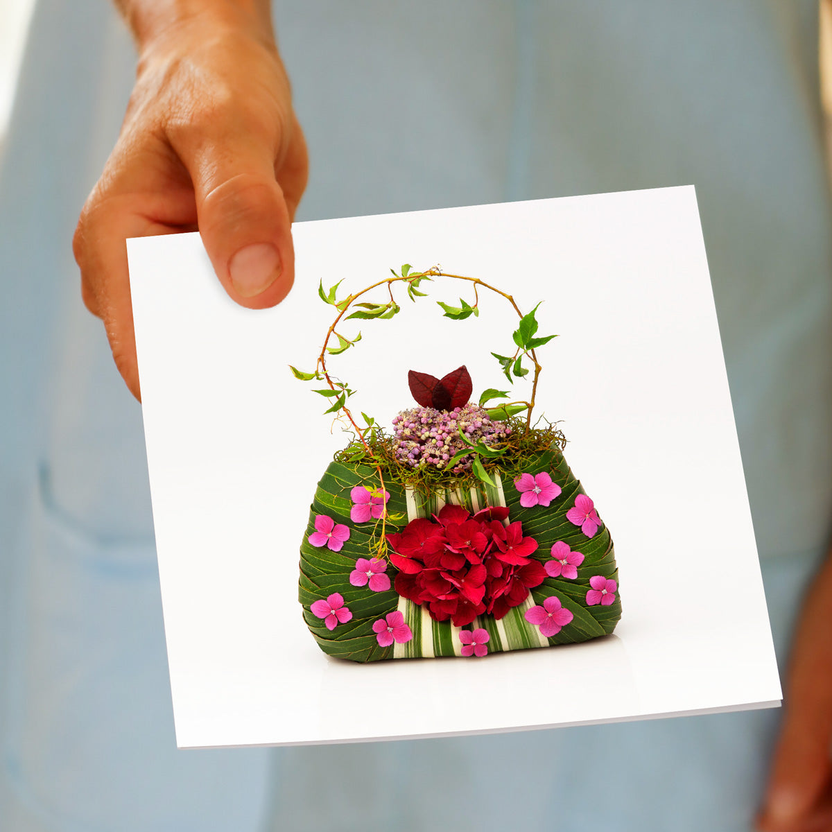 A hand held pink hydrangea card from Golly Gosh Creations. This generous square card s adorned with dainty pink hydrangeas.