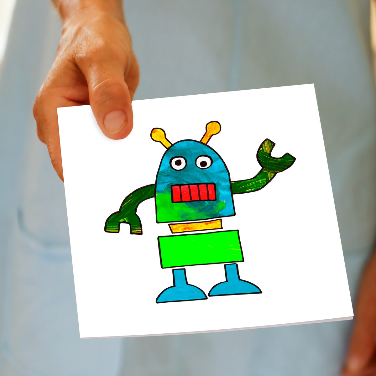 Hand held colourful kids robot greeting card. A hand painted fun card from Golly Gosh Creations. Size 142 x 142 mm.