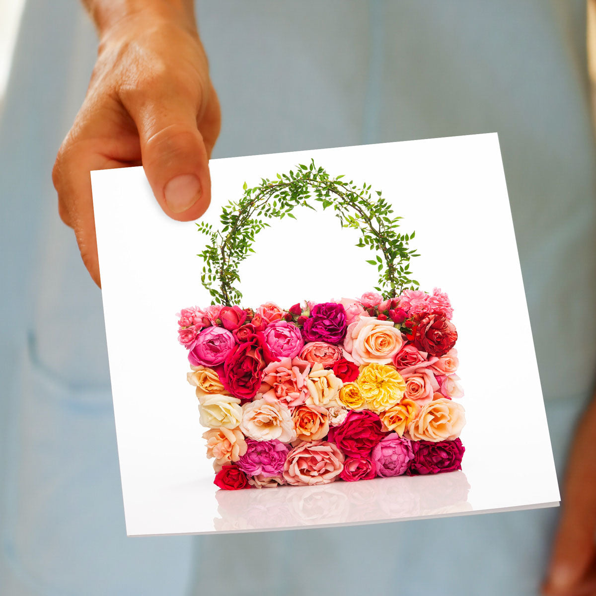 A hand held exquisite rose bag greeting card from Golly Gosh Creations. This generous square card is created from colourful roses.