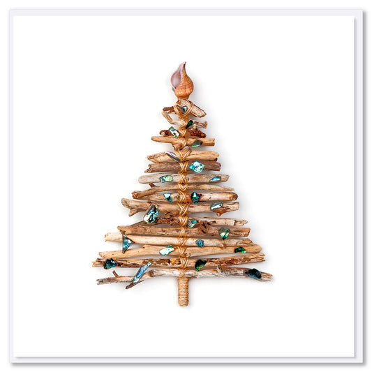 A rustic driftwood tee Christmas card featuring sparkling paua shells.  A quality square greeting card found at Golly Gosh Creations on a white white background.