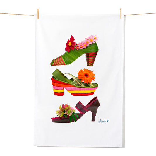 Colorful high-heeled shoes with flowers on a white background