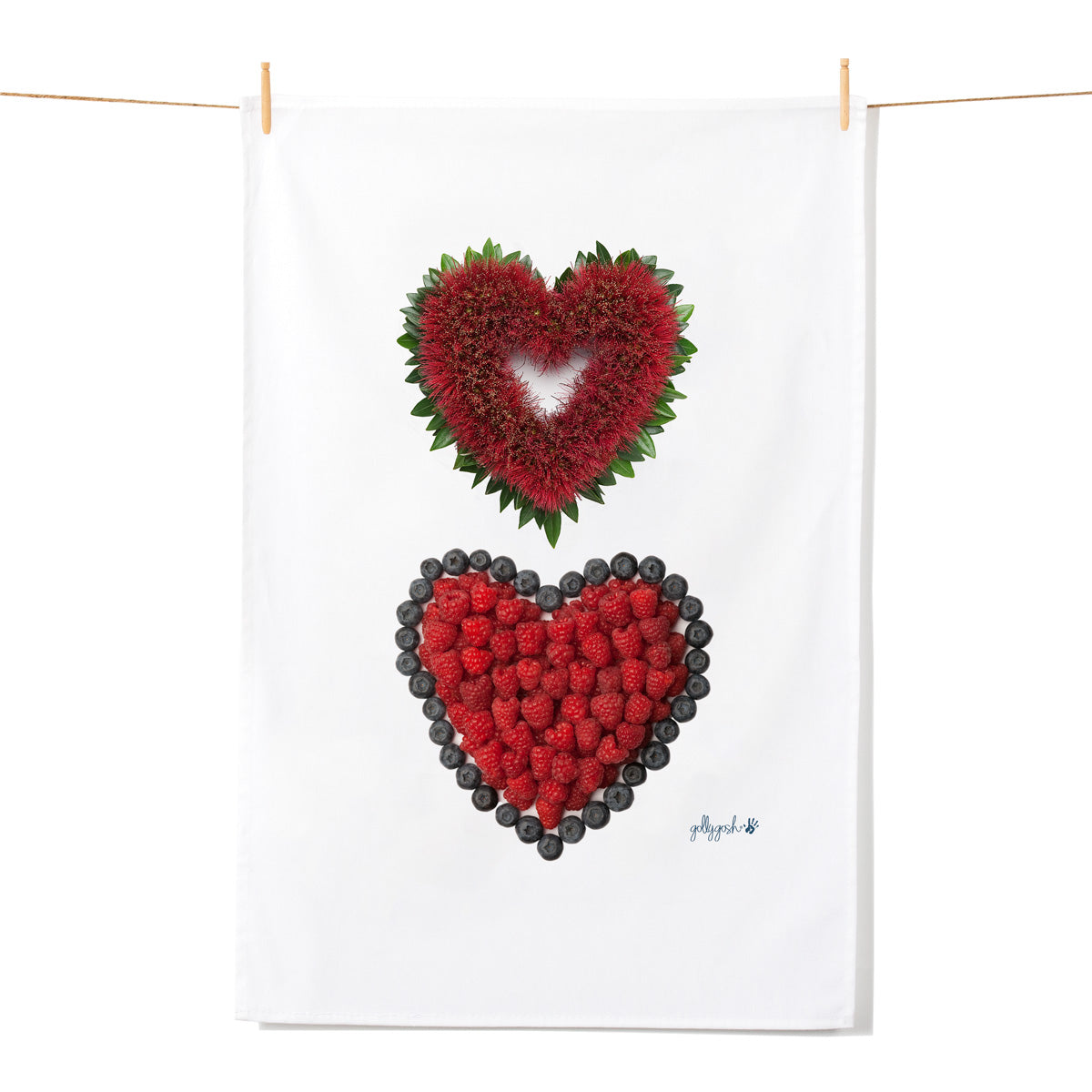 Two hearts arrangements made of red raspberries and pohutukawa blooms on a white background.