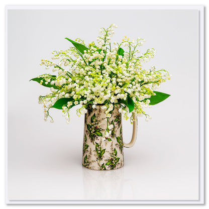 A lily of the valley jug greeting card from Golly Gosh Creations. Size 142 x 142 mm. Delicate white blooms arranged in a matching pretty jug.