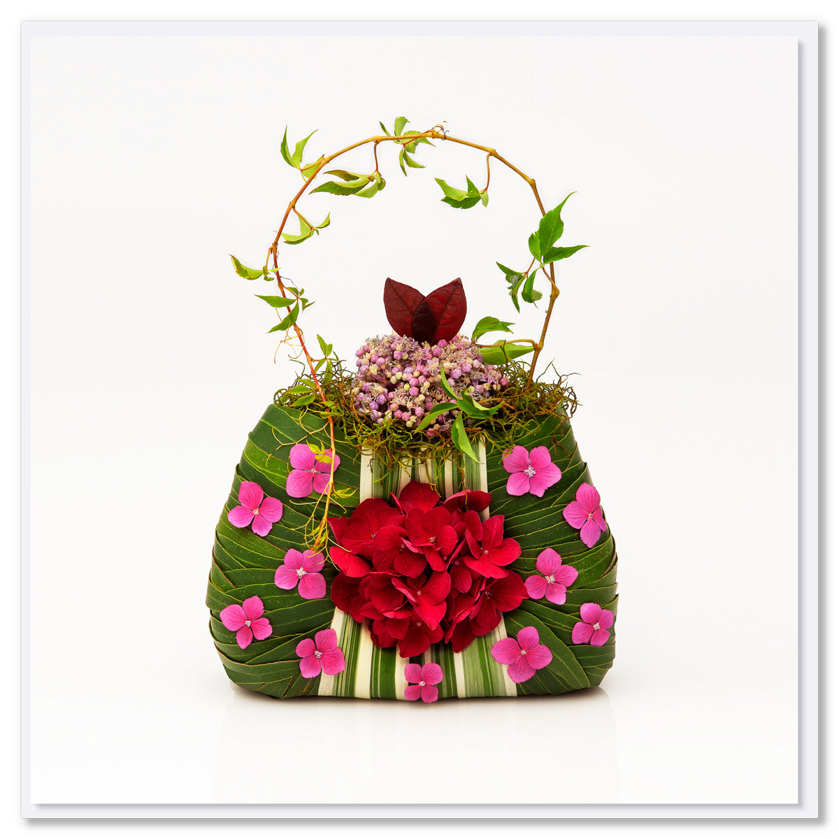 A pink hydrangea bag greeting card found at Golly Gosh Creations. Size 142 x 142 mm. This pretty card is adorned with dainty pink hydrangeas.