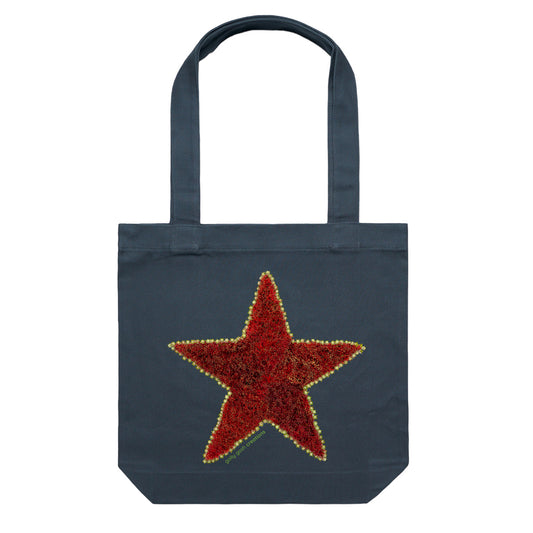 A pohutukawa star cotton canvas tote bag from Golly Gosh Creations.  Crafted from the iconic NZ tree buds. Colour dark blue.