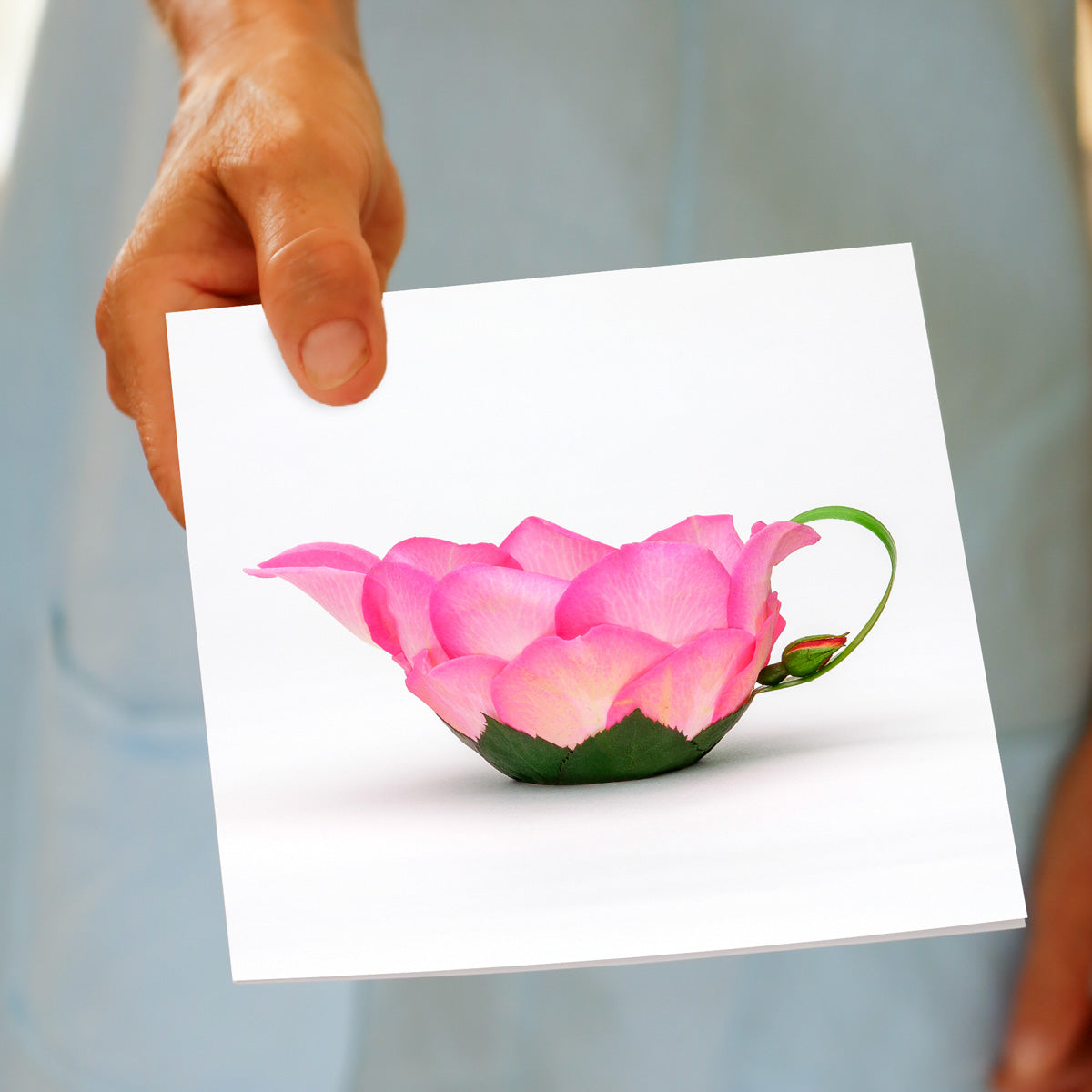 A rose petal jug greeting card from Golly Gosh Creations. Size 142 x 142 mm. Created from vibrant pink rose petals and a  dainty bud.