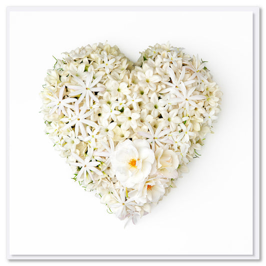 This stephanotis heart greeting card by Golly Gosh Creations is crafted from fresh  white stephanotis blossoms. Size 142 x 142 mm.