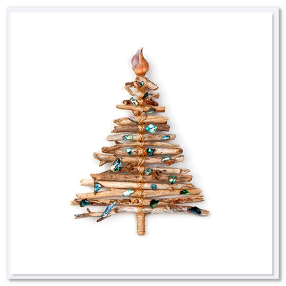 A rustic driftwood tee Christmas card featuring sparkling paua shells.  A quality square greeting card found at Golly Gosh Creations on a white white background. 